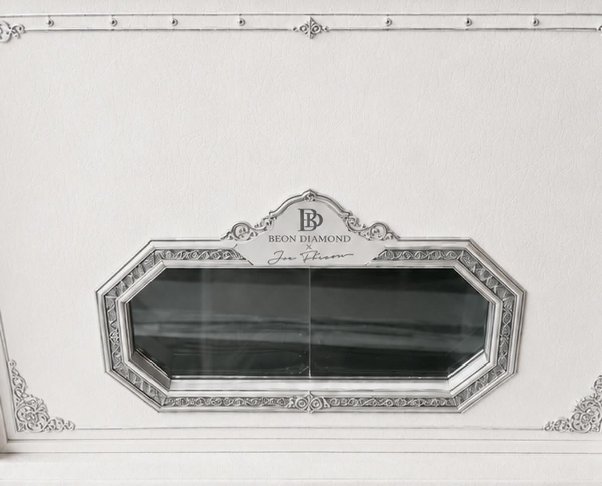 Tag C — arched pediment cresting integrated into the top of the mirror frame