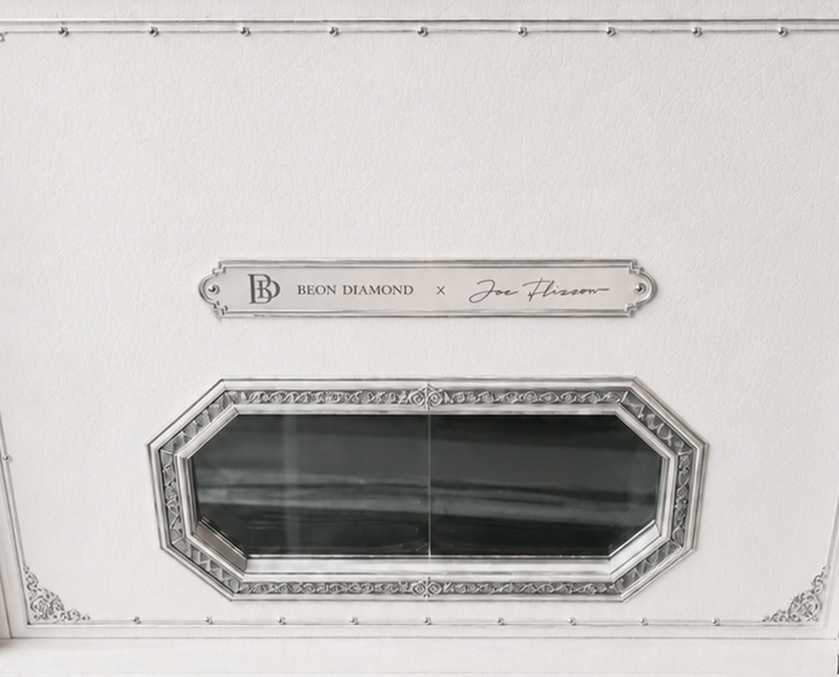 Tag D — single horizontal machined nameplate bar, both names on one line