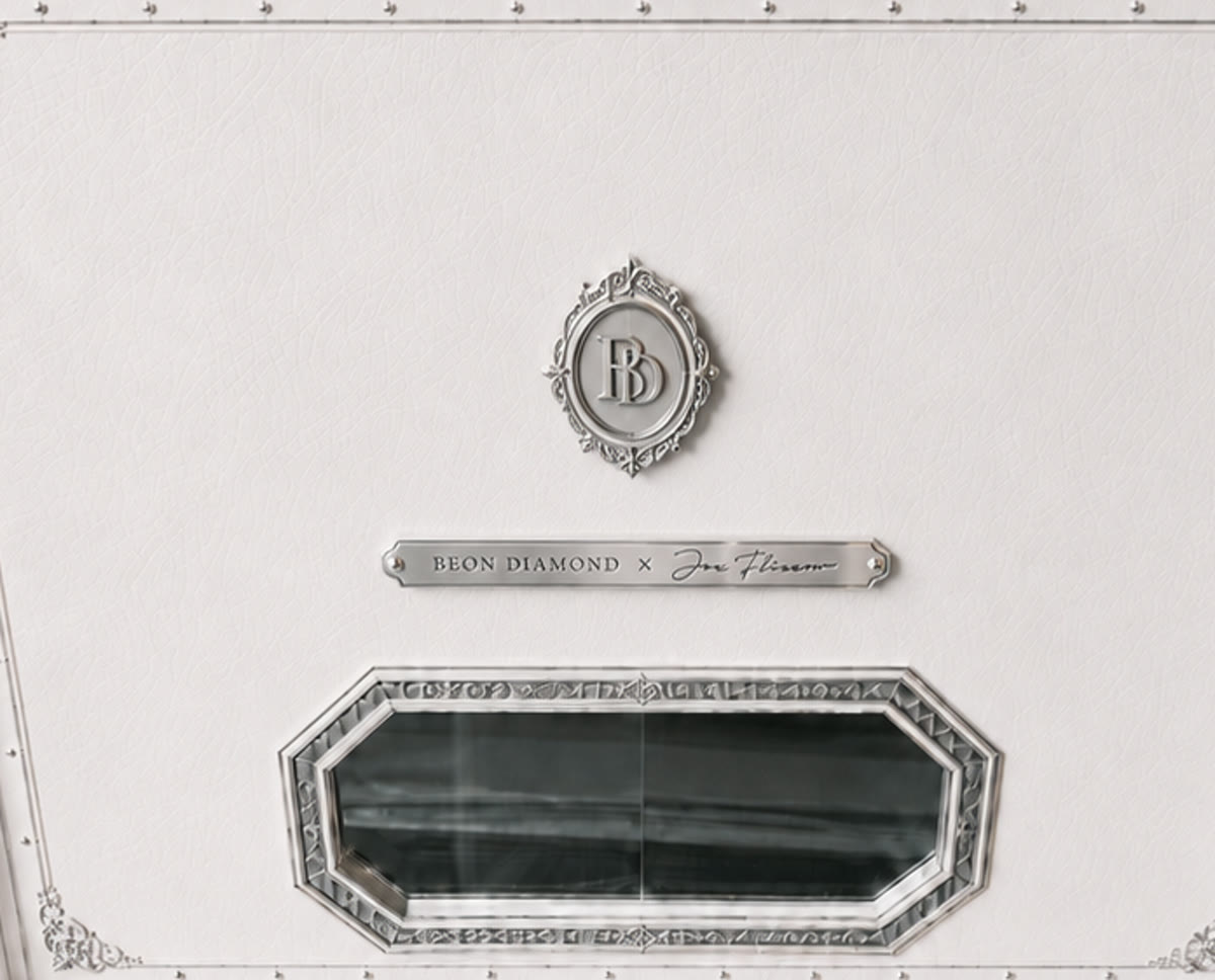 Tag F — ornate BD roundel medallion above a separate slim nameplate bar
